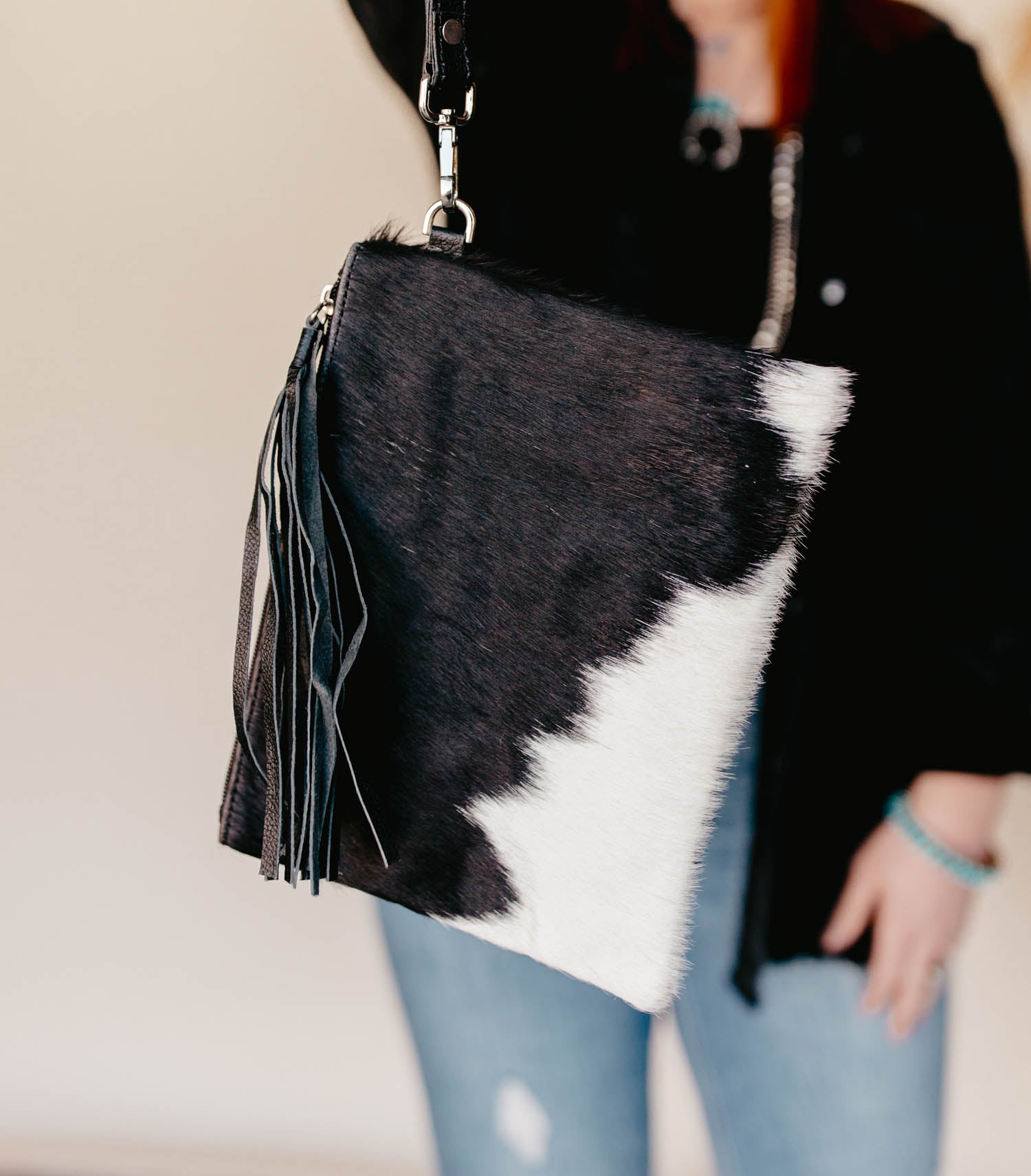 cowhide wristlet with tassel