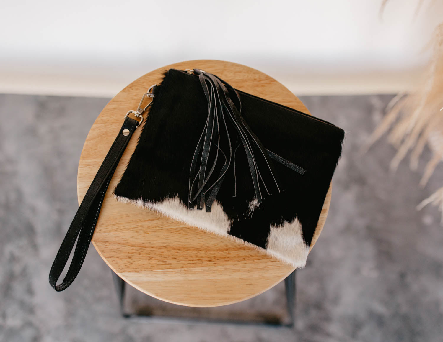 cowhide wristlet with tassel